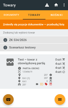 Zakładka towary w module kompletacji, pod zakładkami widoczny pomarańczowy pasek z komunikatem o zmianie pozycji dokumentów i konieczności przebudowy listy, a na górnym pasku ikona ostrzeżenia.